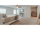 Cozy bedroom with carpet, a ceiling fan, and wall-mounted television at 9830 Black Tupelo Ln, Ladson, SC 29456