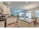 Open kitchen view flows into the dining area and features granite counters at 9830 Black Tupelo Ln, Ladson, SC 29456