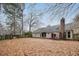 Leafy backyard with patio area and mature trees at 112 Chownings Ln, Goose Creek, SC 29445