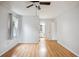 Bright bedroom offers neutral walls, attractive laminate floors, a ceiling fan, and ensuite access at 112 Chownings Ln, Goose Creek, SC 29445