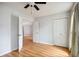 Light-filled bedroom features wood laminate floors, ceiling fan and a closet at 112 Chownings Ln, Goose Creek, SC 29445