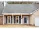 Charming exterior with two windows and hanging flower baskets at 112 Chownings Ln, Goose Creek, SC 29445