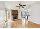 Bright and airy living room with hardwood floors, a brick fireplace, and sliding doors that lead to the outside at 112 Chownings Ln, Goose Creek, SC 29445