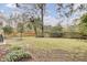 Spacious backyard featuring a hammock, green grass, and beautiful landscaping at 1137 Windsome Pl, Mount Pleasant, SC 29464