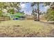 Large grassy backyard with mature trees, a hammock, and a well-maintained lawn at 1137 Windsome Pl, Mount Pleasant, SC 29464