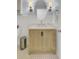 This bathroom features a modern vanity with stylish fixtures, complemented by an oval mirror and decorative lighting at 1137 Windsome Pl, Mount Pleasant, SC 29464