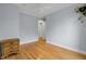 The bedroom offers hardwood floors, a ceiling fan, and an ample closet at 1137 Windsome Pl, Mount Pleasant, SC 29464