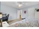 The bedroom boasts a ceiling fan, a work area, and an ample closet at 1137 Windsome Pl, Mount Pleasant, SC 29464