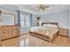 Bright bedroom features a king-sized bed, wood floors, and plenty of natural light at 1137 Windsome Pl, Mount Pleasant, SC 29464