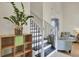 Elegant home entryway featuring a staircase with black iron spindles and wood shelving at 1137 Windsome Pl, Mount Pleasant, SC 29464