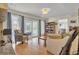 Spacious living room with hardwood floors, screened porch access, and seamless flow to the dining area and kitchen at 1137 Windsome Pl, Mount Pleasant, SC 29464