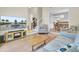 Comfortable living room boasts hardwood floors, seamless access to the dining area, and features a stairway at 1137 Windsome Pl, Mount Pleasant, SC 29464