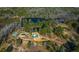 Birds eye view of acreage with several buildings, a pond and trees, providing a serene setting at 120 Rancho Hippey Way, Saint George, SC 29477