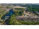 Scenic aerial view of a lakefront property, nestled among the trees and featuring ample green space at 120 Rancho Hippey Way, Saint George, SC 29477
