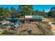 Aerial view of poultry houses and adjacent pens on the farm property at 120 Rancho Hippey Way, Saint George, SC 29477