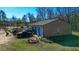 Aerial shot of a large detached garage, with multiple doors and parked equipment at 120 Rancho Hippey Way, Saint George, SC 29477