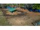 Large grassy field featuring a shaded shelter, perfect for raising animals and enjoying outdoor recreation at 120 Rancho Hippey Way, Saint George, SC 29477
