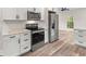 Well-lit kitchen featuring white cabinetry, stainless steel appliances, and stylish countertops at 1294 Horseshoe Bnd, Mount Pleasant, SC 29464