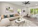 Bright living room featuring modern decor, an L-shaped sofa, and a dining area at 1294 Horseshoe Bnd, Mount Pleasant, SC 29464