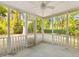 Inviting screened porch with white posts and open views of the surrounding greenery at 1294 Horseshoe Bnd, Mount Pleasant, SC 29464