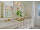 Bright bathroom with double vanity, quartz countertops, gold fixtures and shower with glass door at 130 Marshside Dr, Summerville, SC 29485