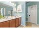 Well-lit bathroom with double sinks, modern fixtures, a large mirror, and a clean design at 1415 Widows Ct, Johns Island, SC 29455