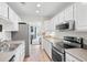 Modern kitchen with stainless steel appliances and views of the Gathering room at 1423 Amanda Park Ln, Charleston, SC 29412