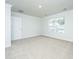 Bright bedroom featuring neutral carpet, a double-hung window, and white trim at 143 Brant Dr, Summerville, SC 29483