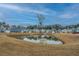 View of a new home community situated on a beautiful pond on a sunny day at 143 Brant Dr, Summerville, SC 29483