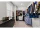Walk-in closet with ample storage and hanging space, a dark dresser, and a large window for natural light at 1510 Martel St, Mount Pleasant, SC 29464
