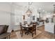 Bright dining area with a wooden table and a decorative chandelier open to the modern kitchen at 1510 Martel St, Mount Pleasant, SC 29464