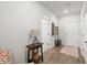 Inviting entryway with a wooden floor, accent table and white doors at 1510 Martel St, Mount Pleasant, SC 29464