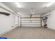 Spacious garage with a sealed floor, shelving, and overhead lighting at 1510 Martel St, Mount Pleasant, SC 29464