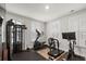 Well-lit gym with modern exercise equipment and plantation shutters at 1510 Martel St, Mount Pleasant, SC 29464
