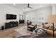 Inviting living room featuring hardwood floors, neutral walls, ceiling fan and comfortable seating at 1510 Martel St, Mount Pleasant, SC 29464