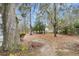 Spacious backyard with mature trees, moss and seasonal foliage for natural shade and a serene outdoor living at 1545 Sterling Oaks Dr, Moncks Corner, SC 29461