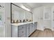 Bathroom featuring a double vanity with matte black faucets and mirrors at 1545 Sterling Oaks Dr, Moncks Corner, SC 29461