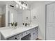 Bathroom featuring a long vanity with a gray base and stylish fixtures at 1545 Sterling Oaks Dr, Moncks Corner, SC 29461