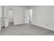 Bedroom featuring gray carpeting, and doors leading to the closet at 1545 Sterling Oaks Dr, Moncks Corner, SC 29461