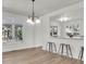 Bright dining area with chandelier lighting and picturesque views from large windows at 1545 Sterling Oaks Dr, Moncks Corner, SC 29461