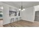 Open dining area with bar seating, seamlessly connecting to the kitchen and living spaces at 1545 Sterling Oaks Dr, Moncks Corner, SC 29461
