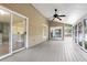 Spacious screened patio featuring a ceiling fan at 1545 Sterling Oaks Dr, Moncks Corner, SC 29461