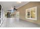 Well-lit screened patio with an exterior view and ceiling fan at 1545 Sterling Oaks Dr, Moncks Corner, SC 29461