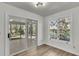 Bright sunroom with sliding doors, offering access to the screened porch at 1545 Sterling Oaks Dr, Moncks Corner, SC 29461
