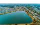 Beautiful aerial view of a lakeside community with colorful homes and lush landscaping at 1608 Fetterbush Ln, Johns Island, SC 29455