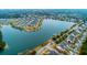Scenic aerial view of lakeside homes with a neighborhood dock for waterfront enjoyment at 1608 Fetterbush Ln, Johns Island, SC 29455