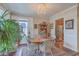 Bright dining room featuring a chandelier and adjacent kitchen at 1608 Fetterbush Ln, Johns Island, SC 29455