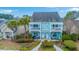 Charming two-story home with a quaint front porch and upper balcony, surrounded by lush landscaping at 1608 Fetterbush Ln, Johns Island, SC 29455