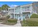 Inviting two-story townhouse with dual balconies and lush landscaping at 1608 Fetterbush Ln, Johns Island, SC 29455