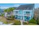 Charming two-story teal house with white balconies and landscaped front yard at 1608 Fetterbush Ln, Johns Island, SC 29455